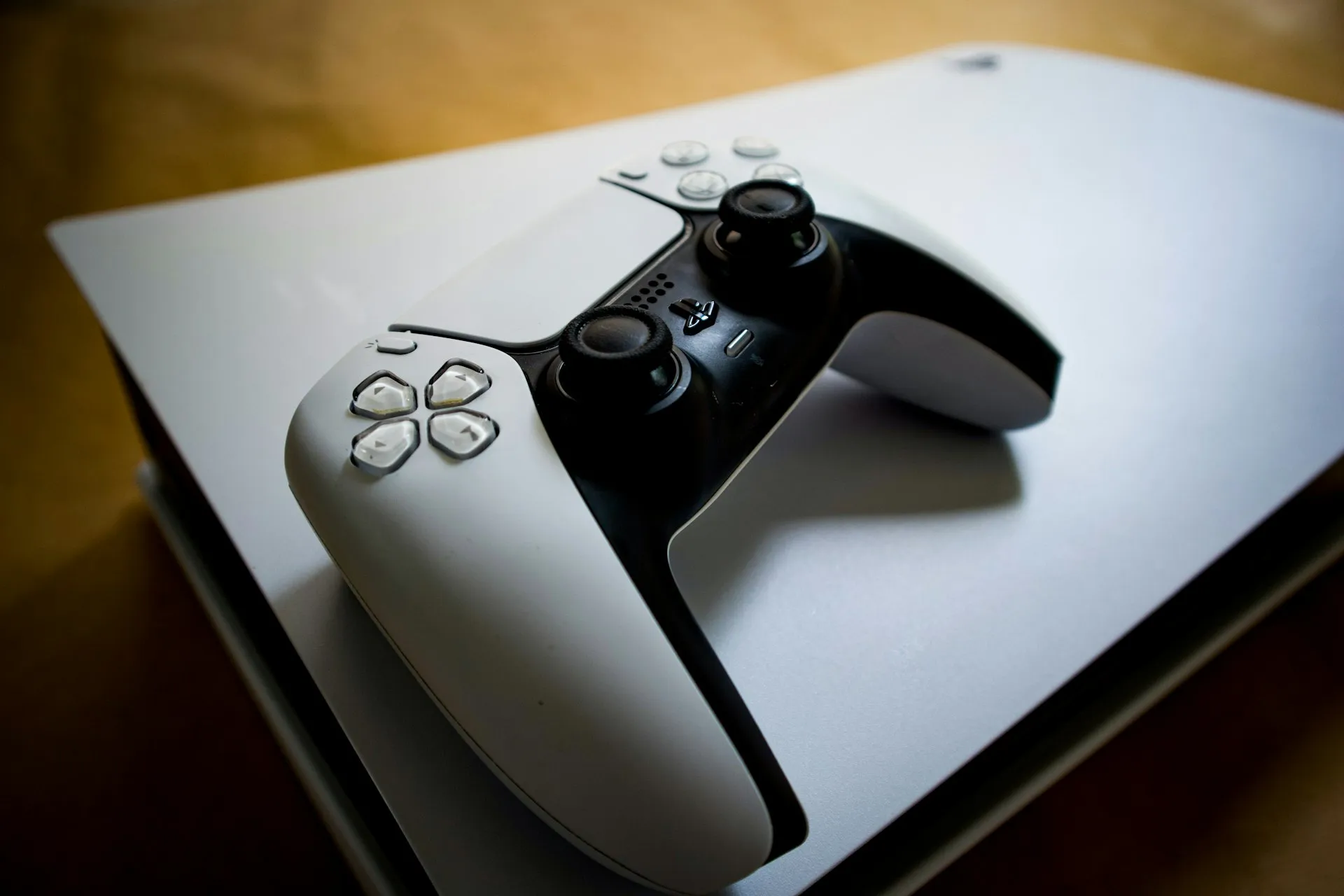 PlayStation 5 console with a DualSense controller PlayStation 5 console with a DualSense controller